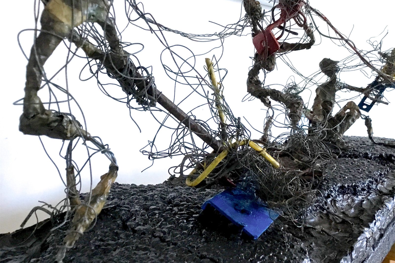 Detail of the wire figures and found materials in Men at Work